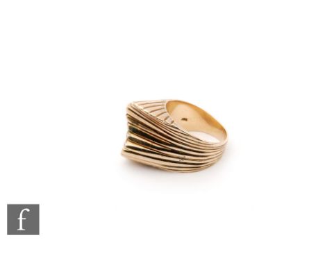 A mid 20th Century 14ct abstract ring with a ribbed S shaped head, weight 15g, ring size R. 