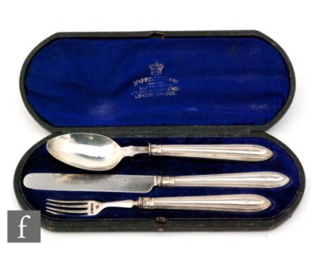 A cased hallmarked silver knife, fork and spoon set with beaded details to handles, Sheffield 1870, Martin &amp; Hall. 