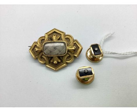 A Highly Decorative Victorian Mourning Brooch, the glazed panel baring hairwork design, within highly decorative love knot st