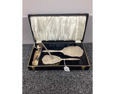 A Hallmarked Silver Backed Four Piece Dressing Table Set, engine turned with part foliate decoration, in fitted case.