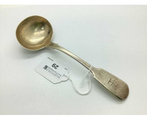 A Victorian Hallmarked Silver Sauce Ladle, WE, London 1833, of plain design baring crest to handle, rattail pattern verso (55