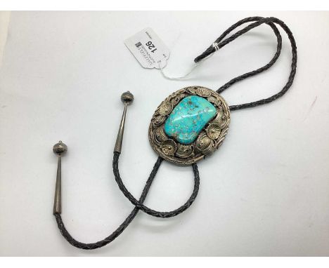 A Turquoise Coloured Polished Hardstone Inset Bolo Tie, the large foliate inspired border, stamped "W.DENET-DALE" "STERLING",
