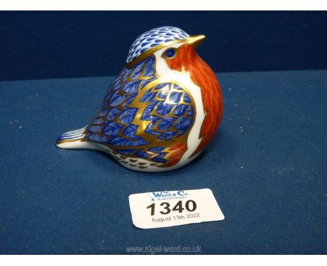 A Royal Crown Derby paperweight in the form of a robin having a colourful blue coat and red breast, edged with burnished gold