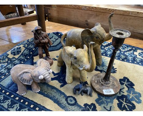 A quantity of miscellanea including two elephants shaped from horn, French shepherd figure, turned candlestick, etc.