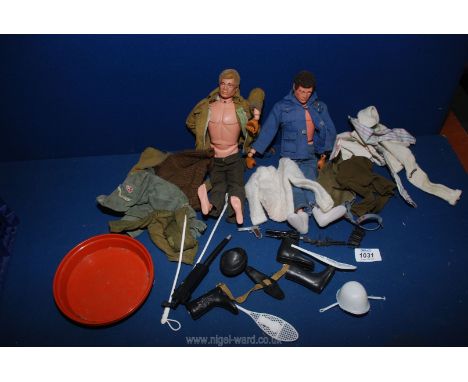 Two Action Man dolls with clothing, knitted cardigan, army jacket, guns, boots, snow shoes, etc.