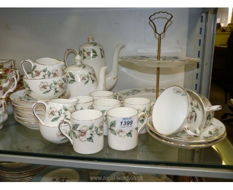 A Crown Staffordshire coffee set in 'Wild Rose' pattern including six coffee cans and saucers, two cups and saucers, coffee p