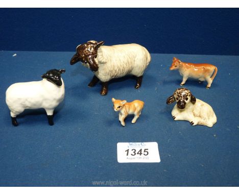 A quantity of farm animal figurines including a small black faced Beswick sheep, a pottery ram and lamp with mottled brown fa