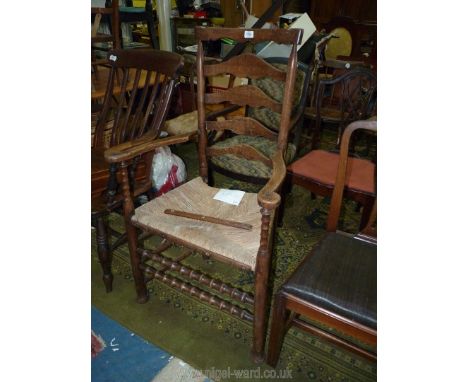 A late 19th c. Oak and rush Lancashire Armchair with ladder back bobbin turned detail.