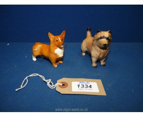 Two Beswick dogs including a white and tan Corgi 2⅔" tall and a Cairn terrier 2¾" tall.