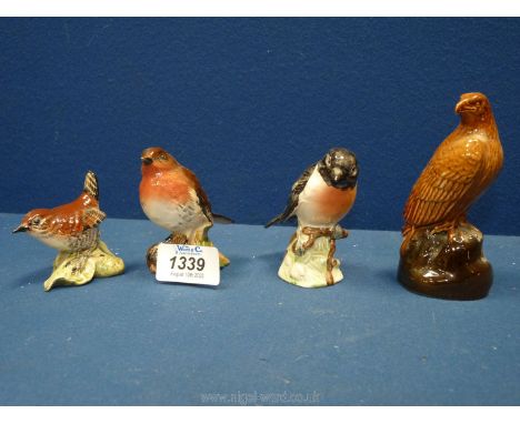 Four Beswick birds to include a robin, wren (sticker present,) stonechat, and Beneagles scotch whisky eagle, approx. 3¼", 2½"