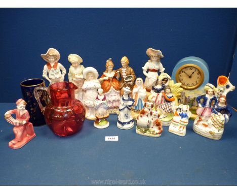 A quantity of figures including small Staffordshire flatbacks, German porcelain couple, spill vases, ceramic cased dock etc.,