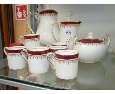 An Aynsley 'Durham' part coffee service for six people including coffee cans and five saucers, milk jug, coffee pot, and a su