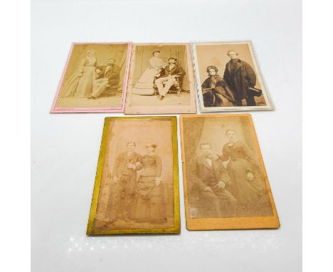 Featuring thicker card photo material, plastic protective layer covering on one photo. Depicts range of assorted families rep