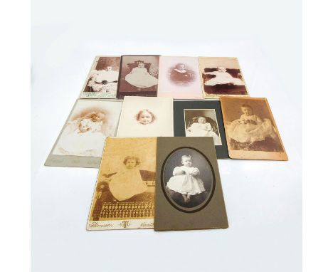 Featuring thicker card photo material or plastic protective layer covering on all photos. Depicts individual children, infant