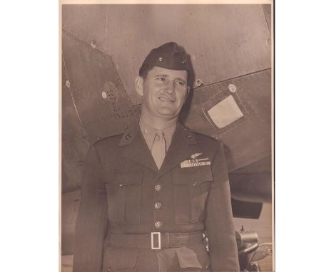 Black and white portrait of a WWII soldier in full uniform, standing outside a plane.Dimensions: 11"W x 14"HCondition: Age re