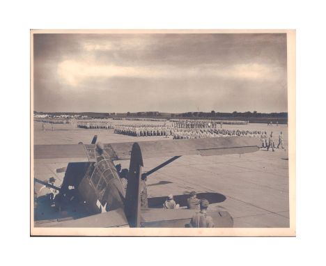 World War II photo; the USAAC in formation, the Curtiss O-52 Owl aircraft in foreground.The Curtiss O-52 Owl was an observati
