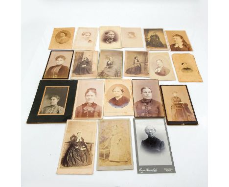 Featuring thicker cardstock on all photos and some also include plastic holder. Depicts portrait photos of middle aged female