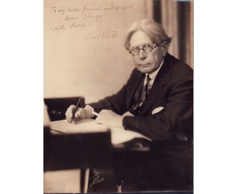 Vintage portrait of a professor with round framed glasses, fountain pen and cigarette in hand.Constructed scene; glossy finis