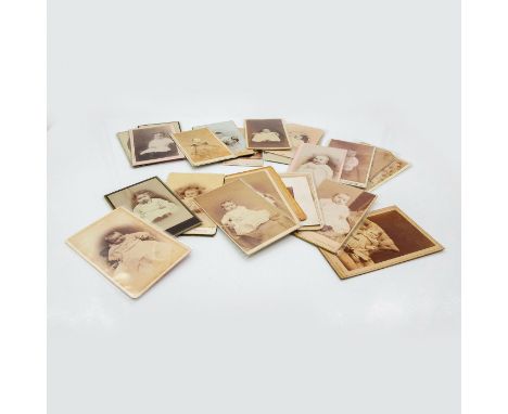 Featuring thicker card photo material or plastic protective layer covering. Depicts individual children of infant and toddler