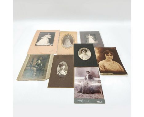 Featuring thicker cardstock material or plastic protective layer covering on all photos except for 1. Depicts range of adult 