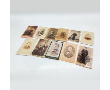 Featuring thicker cardstock on all photos and also include plastic holder. Depicts portrait photos of male individuals, ages 