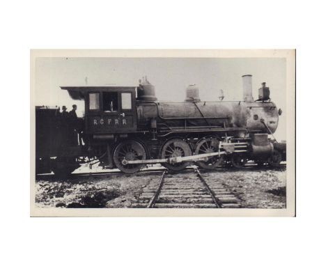 Antique black and white silver gelatin photograph featuring the Kettle Valley steam engine blocking the Great Northern Railwa