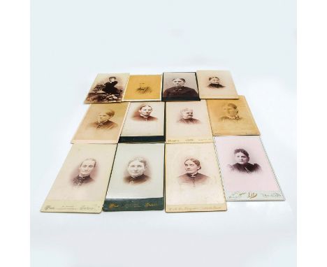 Featuring thick cardstock photographic material. Depicts portrait photos of mature female individuals ranging in age. Largest