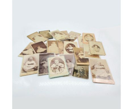 Featuring thicker card photo material, plastic protective layer covering. Depicts individual children of infant and toddler a