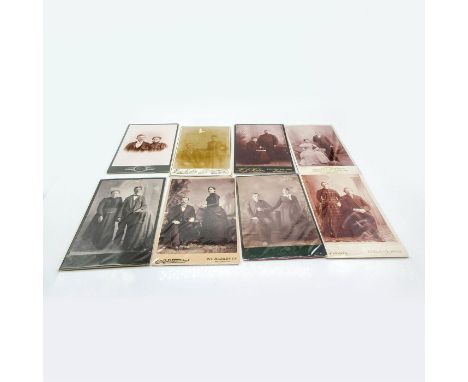 Featuring thicker card photo material, plastic protective layer covering. Depicts range of assorted families represented by c
