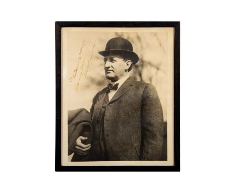 Housed in a black wooden frame. Depicts a portrait photographic print of the 1913 - 1914 Associate Justice of the Supreme Cou