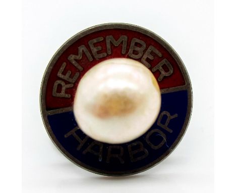 Circular shape, states "Remember" "Harbor" to either side of central pearl decoration. Sterling silver back.Dimensions: 0.5" 