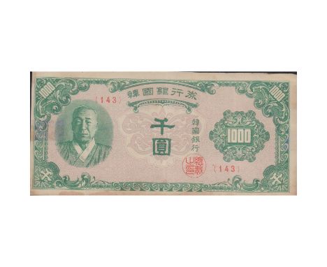 Green banknote with trellis patterns and portrait of South Korea's president, Syngman Rhee.In circulation from July 22, 1950 