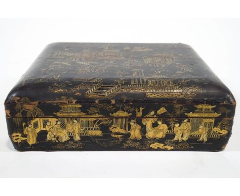 A 19th century Chinese export lacquer gaming compendium with outer case decorated with gilt on black with courtly scenes of f