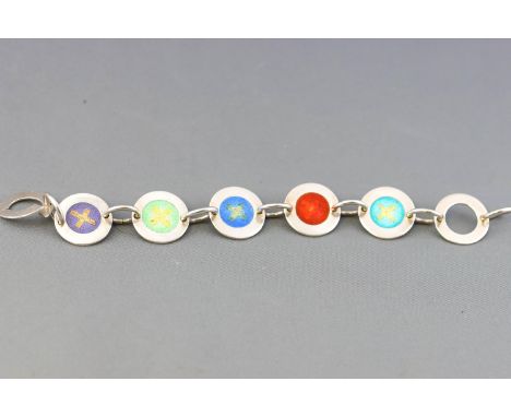A white metal link bracelet, set with five round panels highlighted with a central coloured enamel motif, stamped 925, 20cm l
