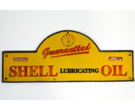 Automobilia - a dome topped cast metal and enamel Shell Oil sign, 20cm x 51cm