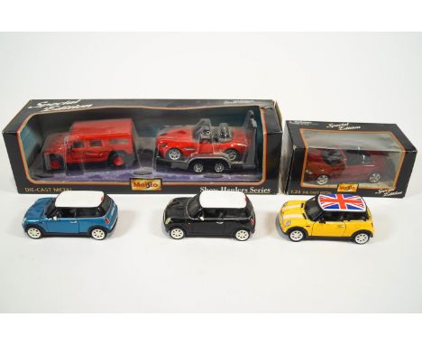 A boxed Maisto 1:27 Hummer, a 1:24 BMW on trailer, a boxed Maisto 1:24 Audi TT with three 1:24 die cast Mini Coopers and othe