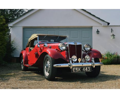 A 1952 MG TD, registration number ESK 443, chassis number 20393, engine number 20783, maroon.  Introduced in 1949 to replace 