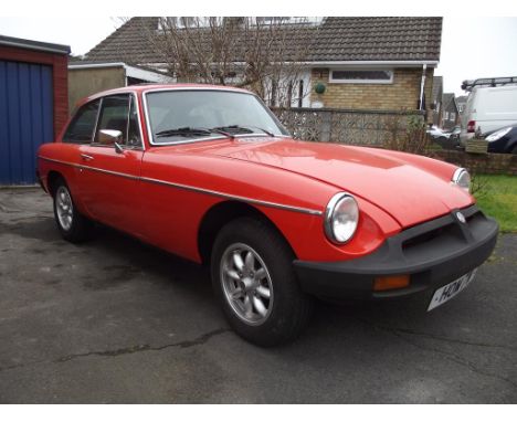 A 1980 MG B GT, registration number HOM 7W, Blaze orange. The MG B has been the mainstay of the classic car world for decades