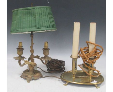 19th century two branch brass table lamp set on oval base supported by small paw feet, with oval clip-on knife pleated green 