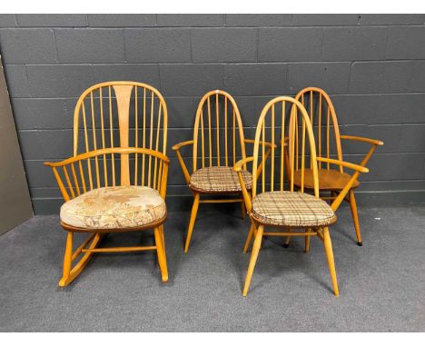 An Ercol elm seated rocking armchair 103cm x 62cm x 74cm together with three Ercol armchairs (4)