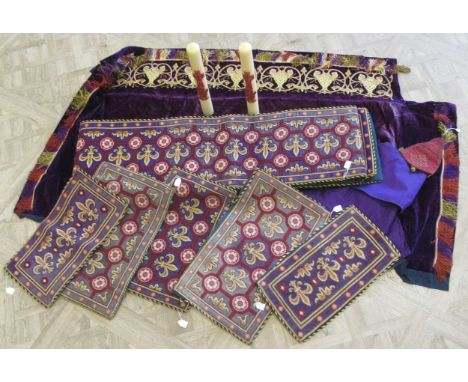 Late 19th century tapestry panels, with geometric design of rosettes and fleur du Lys over an amethyst colour ground stitched
