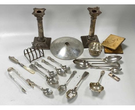 A collection of silverware including flatware, toast racks candlesticks etc., 808g (26ozt) gross weighable silver
