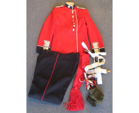 Uniform of the Coldstream Guards, red wool jacket with embroidered Coldstream Guards emblem to the collar and fitted with sil