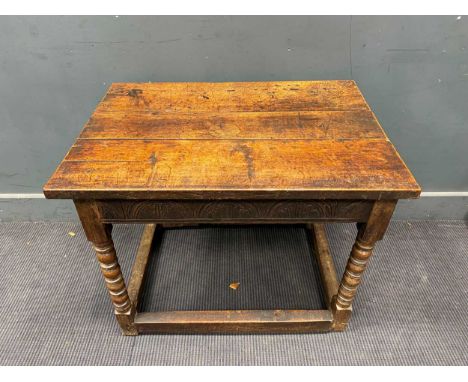 An 18th century and later oak side table on four bobbin turned legs and carved frieze63 x 79 x 57cm