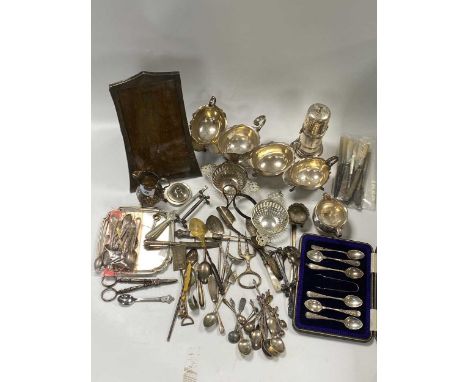 A collection of silverware including sauce boats, caster, waiter, cream jugs, bonbon dishes, salt and spoons, photo frame, fl