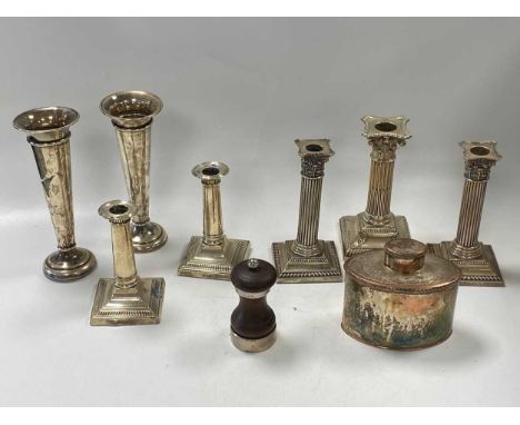 Two pairs of silver candlesticks together with a single candlestick and a pair of silver vases, all loaded, along with a silv