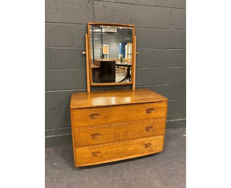 A 20th century Ercol type dressing table with swing mirror over three drawers, 138cm x 92cm x 48cm