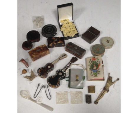 Three late 19th century tortoiseshell pill boxes together with two mother of pearl inlaid miniature guitars, a bone carving o