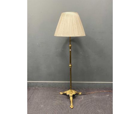 A gilt brass standard lamp 131cm to top of the bayonet fitting, not including shade, Not tested