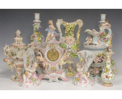 Dresden style floral encrusted candlesticks, three ewers, mantel clock, and three others
